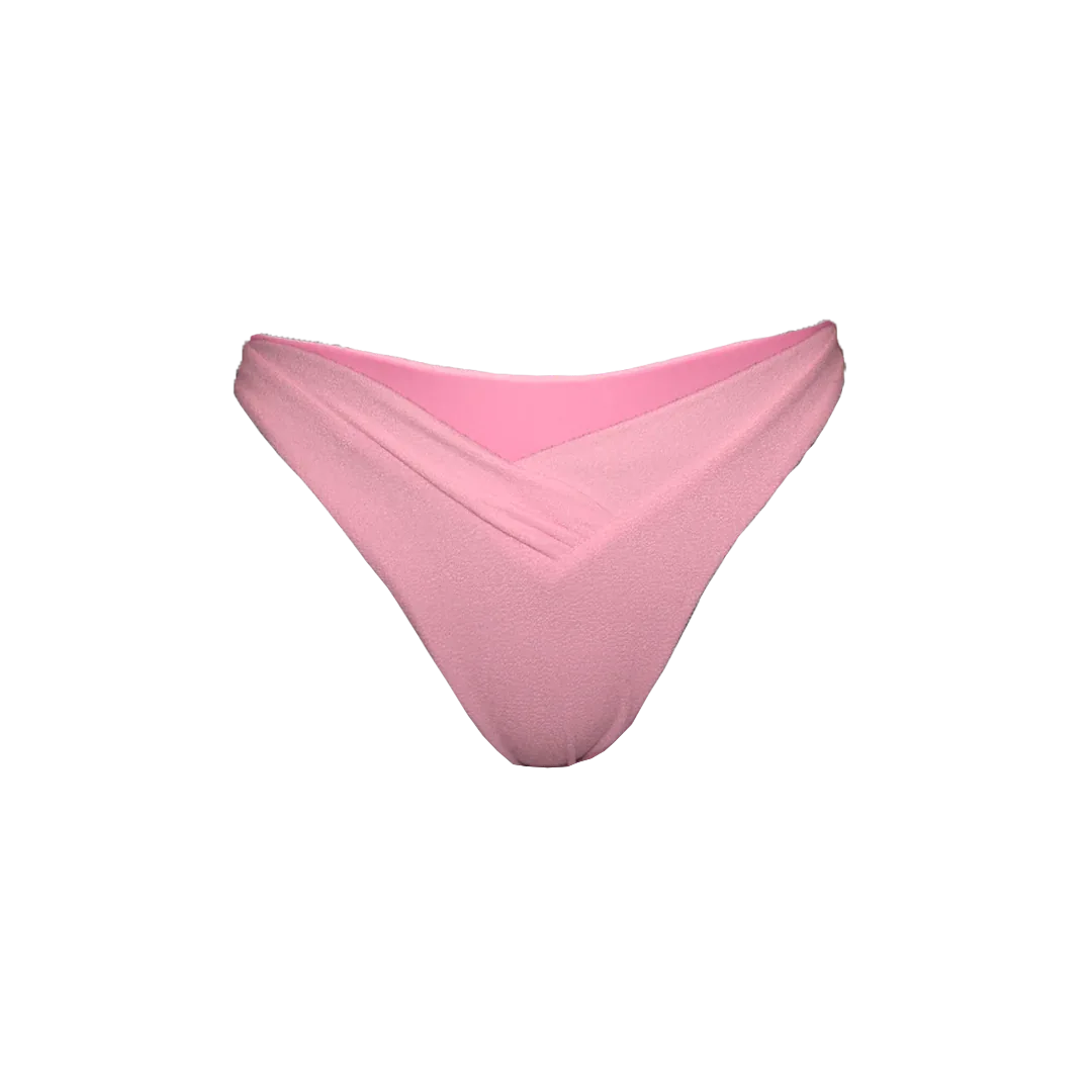 Bait bikini bottom in peach pink flat lay with V-cut front